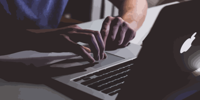 fingers typing on computer