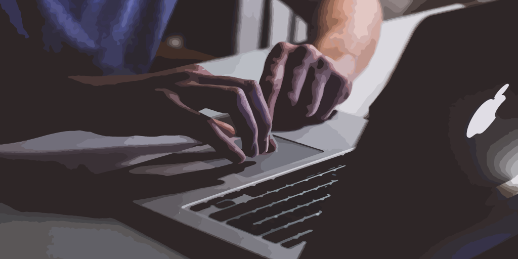 fingers typing on computer